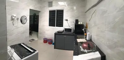 a kitchen with a sink and a counter top at Modern 3 bedrooms House, Walking distance to Kulim Town by Mr Homestay in Kulim