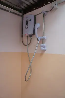 a hospital room with a phone on the wall at Rain Forest Inn in Ringlet