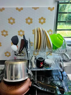 a drying rack with dishes and plates in a kitchen at Homestay Fayyadh Teluk Intan 3Room2Bath in Teluk Intan