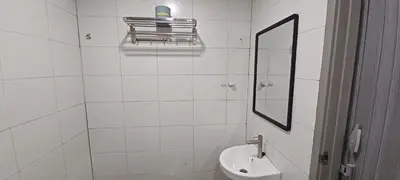 a white bathroom with a sink and a mirror at Grand Suite @ The CEO Penang in Bayan Lepas