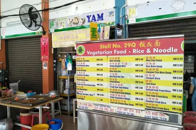 a sign for a restaurant with a menu of food at Grand Suite @ The CEO Penang in Bayan Lepas