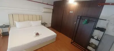 a bedroom with a bed with a butterfly on it at Grand Suite @ The CEO Penang in Bayan Lepas