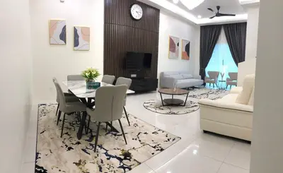a living room with a dining table and a couch at Homestay Muslim Gunung Rapat Ipoh in Ipoh