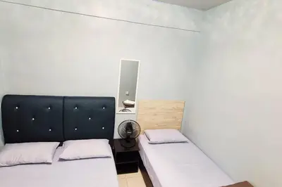 two beds in a small room with white walls at CH Homestay Tanah Rata, Cameron Highlands, Keyless Entry in Tanah Rata