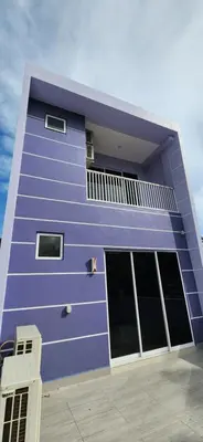 a purple building with windows and a balcony at La Belle Maison 12 @ Gurney Kelawai/Pulau Tikus/Georgetown in George Town
