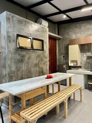 a kitchen with a large table and a bench at Traveler's Stay @ Ipoh (10Pax) in Ipoh