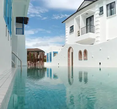 a pool of water in front of a building at Ipoh Santorini Hideaway - Hotel Inspired in Ipoh