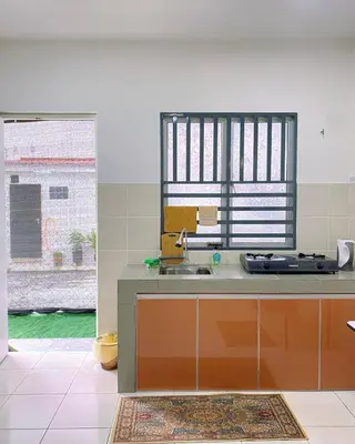 a kitchen with a sink and a window at WawAmir Homestay @ Seri Iskandar in Seri Iskandar
