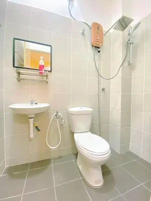 a bathroom with a toilet and a sink at WawAmir Homestay @ Seri Iskandar in Seri Iskandar