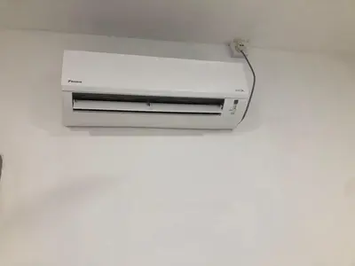 a white printer sitting on top of a wall at SKYN SMART HOME in Ipoh