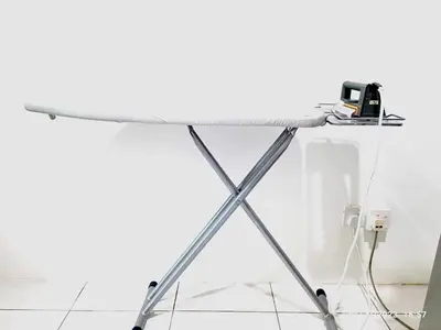 a white table with a white cloth on top at Homestay Nafisah in Tapah Road