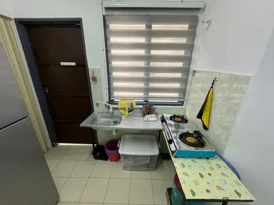 a small kitchen with a sink and a window at Homestay Cikgu Iqa (Muslim) in Kuala Kangsar