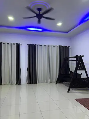 a living room with a ceiling fan and curtains at Homestay De' Afraa Sungai Besar IslamFriendly in Sungai Besar