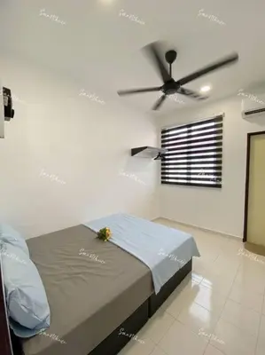 a bedroom with a bed and a ceiling fan at SmartChoice Homestay in Bukit Mertajam