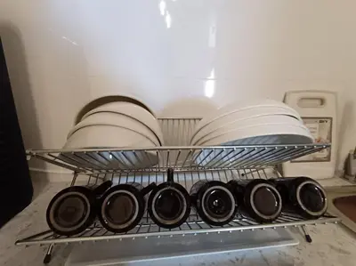 a rack with plates and dishes in a dishwasher at The Horizon Ipoh Dual L13 by Grab A Stay in Ipoh