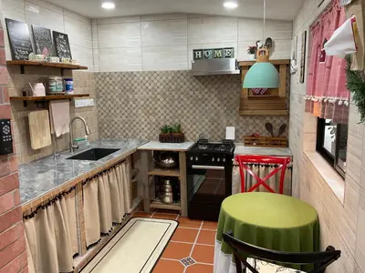 a small kitchen with a sink and a stove at Jessie Home in Bukit Mertajam