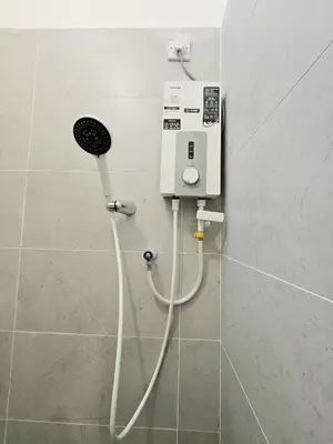 a bathroom with a soap dispenser on a wall at Air-home No 28 Simpang near Aulong Econsave, 3BR, 7pax, Netflix in Simpang