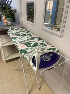 a table with a toaster sitting on top of it at ROYAL LILY TANAH RATA BY JUNIKASTAY in Tanah Rata