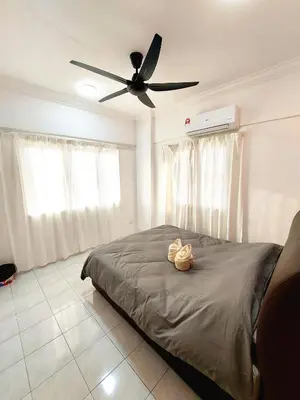 a bedroom with a bed with a ceiling fan at EC14-Georgetown-3room-PrivateHouse in George Town