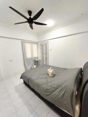 a bedroom with a bed with a ceiling fan at EC14-Georgetown-3room-PrivateHouse in George Town