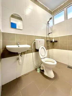 a bathroom with a toilet and a sink at Ipoh IGB Homestay by Comfort Home in Ipoh