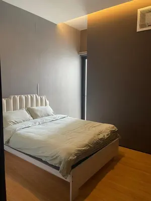 a white bed in a room with a window at Penang Amazing SeaView Private Lift \u68b9\u57ce\u5bcc\u4eba\u533a\u7edd\u7f8e\u6d77\u666f\u516c\u5bd3\u79c1\u4eba\u7535\u68af in Tanjong Tokong