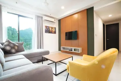 a living room with a couch and a table at Onsen Sunway in Tambun