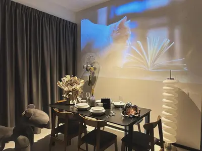 a dining room with a table and a book on the wall at DD Condominium 2Bedroom Sea view Georgetown Penang in Jelutong