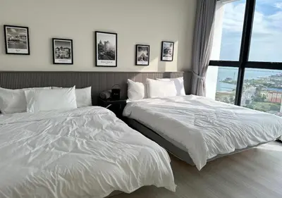 two beds sitting next to each other in a bedroom at DD Condominium 2Bedroom Sea view Georgetown Penang in Jelutong