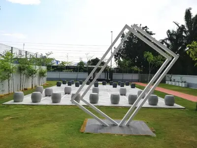 a sculpture of a triangle on a field of grass at Sweet Homestay 1 The Venus Sitiawan in Sitiawan