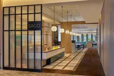 a lobby with a saccao sign on a glass wall at Penang Marriott Hotel in George Town