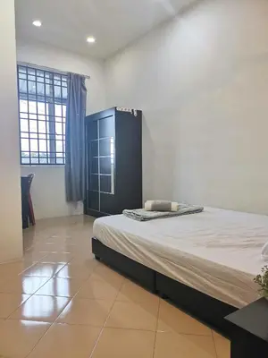 a bedroom with a large bed in a room at White House 19 Room B in Bukit Mertajam