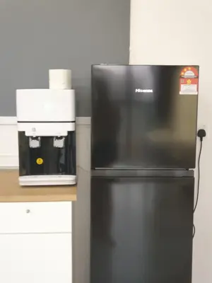 a black refrigerator in a kitchen with a coffee maker at Urban Suite Spacious 2 or 3 Bedroom and 2Bathroom at Georgetown by URBAN STAYCATION HENG COSY in Jelutong