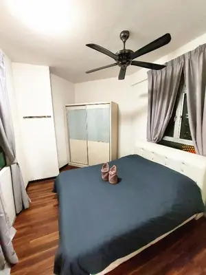 a bedroom with a bed with a ceiling fan at TuR15 PisaStadium 9pax 4rooms PrivateHouse in Bayan Lepas