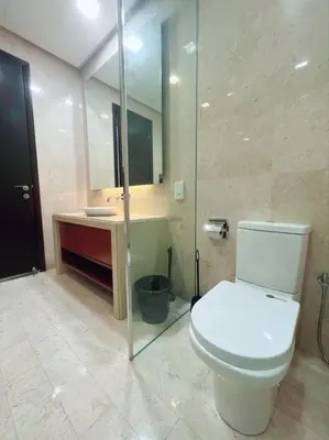 a bathroom with a toilet and a sink and a mirror at Strait Quay Marina Cozy Suite with Bathtub by Uptrend Home Management in Tanjong Tokong