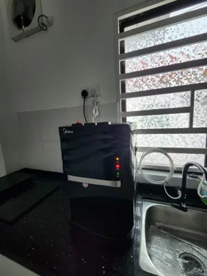 a kitchen with a sink next to a window at Thetamu Homestay مسلم Kepala Batas in Kepala Batas