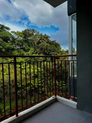 a balcony with a view of a forest at Adamhawa Homestay Emerald Avenue Brinchang in Brinchang