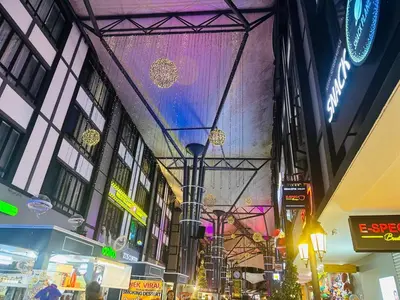 a building with a purple light hanging over a street at Adamhawa Homestay Emerald Avenue Brinchang in Brinchang