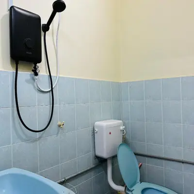 a bathroom with a shower and a toilet with a camera at CYC homestay 48 Bercham in Kampong Batu Lapan