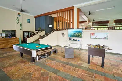a room with a pool table and a staircase at SGI Vacation Club Villa @ Damai Laut Holiday Resort in Lumut