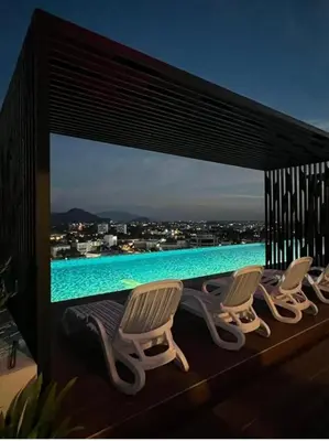 a group of chairs sitting on top of a swimming pool at BlissFul Homestay_Horizon@IPOH in Ipoh