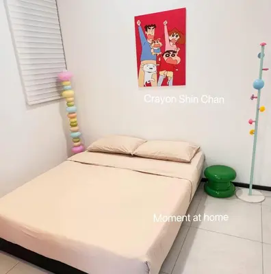 a bedroom with a bed with a poster on the wall at Georgetown Seaview & Cityview Childroom Infinity pool with Carpark in Jelutong