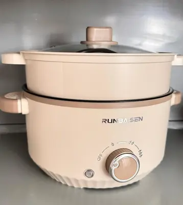 a slow cooker sitting on top of a counter at Georgetown Seaview & Cityview Childroom Infinity pool with Carpark in Jelutong