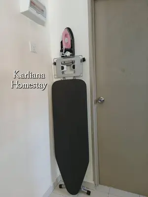 a black toilet in a bathroom with a door at Modern Classy Karliana Homestay Penang in Kepala Batas