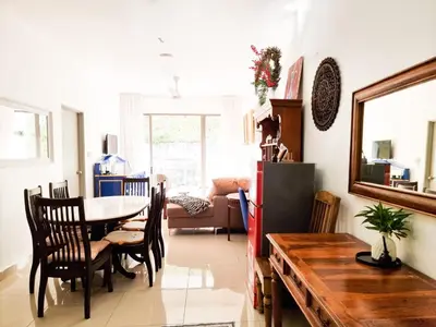 a kitchen and dining room with a table and chairs at Mossy Forest Family Retreat II, 2-8 pax, Cameron Highlands in Cameron Highlands