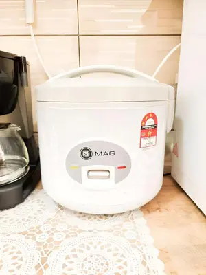a rice cooker sitting on a kitchen floor at Mossy Forest Family Retreat II, 2-8 pax, Cameron Highlands in Cameron Highlands