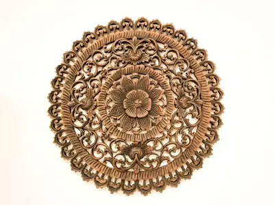 a gold plate with a flower pattern on a white background at Mossy Forest Family Retreat II, 2-8 pax, Cameron Highlands in Cameron Highlands