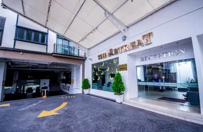 a store front of a building with a sign on it at Nova Highlands Hotel in Cameron Highlands