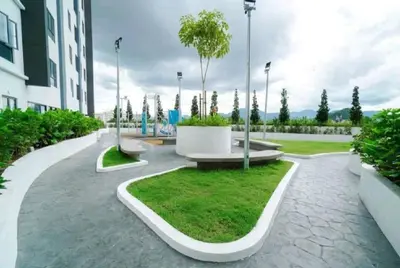 a park with a bench with a tree in it at Seri Ipoh - Horizon Apartment in Ipoh