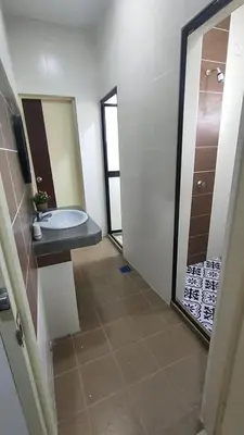 a bathroom with a sink and a toilet and a mirror at Homestay Gerik Le rizq Homestay~ Heart of Gerik ~ Cozy in Gerik